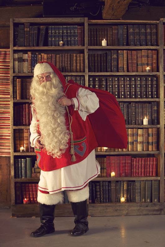 Explorez les merveilles magiques du village du Père Noël au Pôle Nord avec la photo de Mère Noël du Père Noël avec son sac de cadeaux. Viendra-t-il te voir?